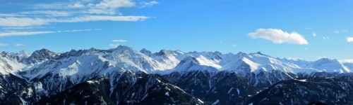 Alpine panorama with snow-covered mountain peaks in winter. Taken in the ski resort of Serfaus Fiss
