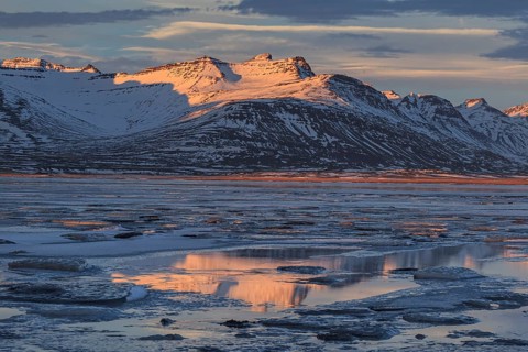 Morning light on Bergen on the coast, icy fjord, Breiddalsvik, East Fjords, Iceland, Europe
