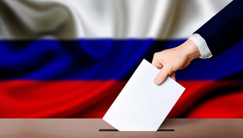 Presidential elections of the Russian Federation. Hand holding ballot in the ballot box with Russia