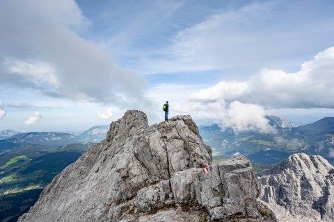 Mountaineer on a narrow rocky ridge, Watzmann crossing to Watzmann Mittelspitze, view of mountain