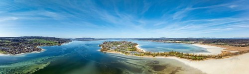 Aerial view, panorama of the island of Reichenau at low tide and spring-like vegetation, Lake