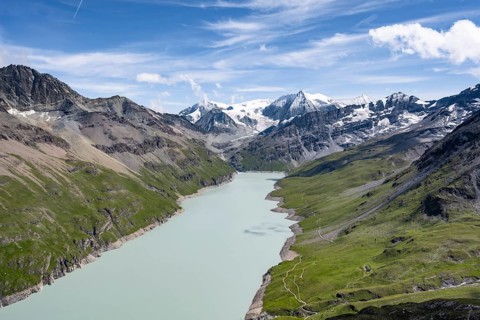 Picturesque mountain landscape, view of a blue mountain lake, Lac des Dix reservoir, behind