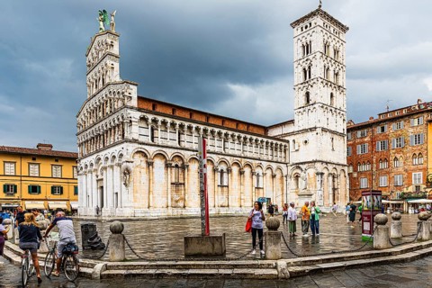 Rain clouds over the church and Piazza San Michele, historic city centre, Lucca, Tuscany, Italy,