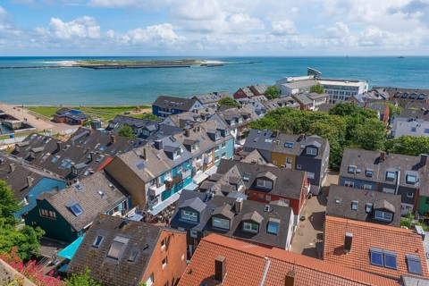 View of the Unterland and the dune from the Oberland Promenade, colourful houses, architecture,