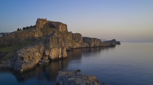 Drone shot, first morning light, Lindos, Acropolis of Lindos, Picturesque castle on a cliff