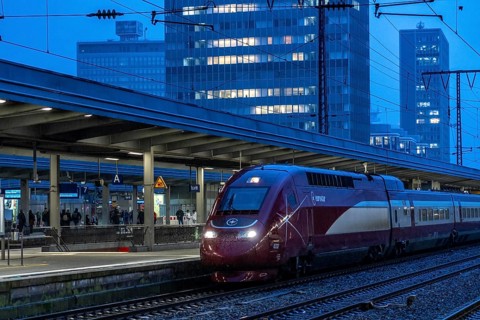 Eurostar train, train traffic, city centre skyline, Essen central station, North Rhine-Westphalia,