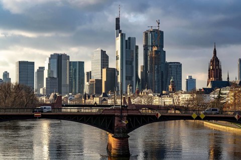 Skyline of the city centre of Frankfurt am Main, river Main, Ignatz-Bubis-Bridge, dusk, Hesse,