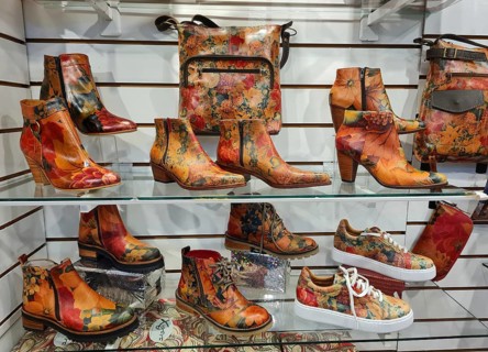 Shelf full of colourful shoes and handbags in a vibrant style, La Boca district, Buenos Aires,