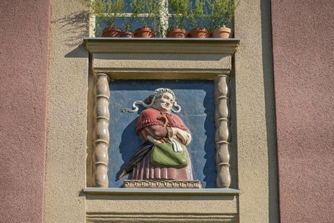 Midwife, relief on old building, former woman's and children's clinic, today St. Marien residential