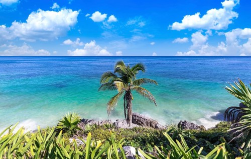 Mexico, Tulum Archaeological Zone and Mayan pyramids on scenic ocean shore, Central America