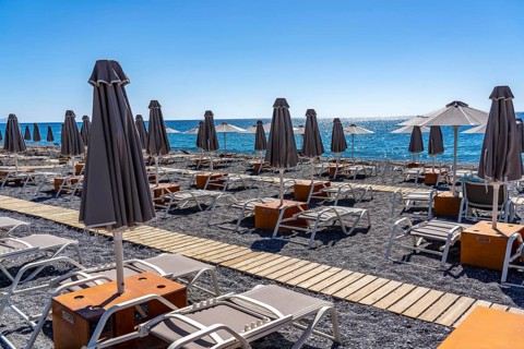 Beach, empty, organised, with sun loungers and parasols, catering, bay at Koutsounari Beach, on the