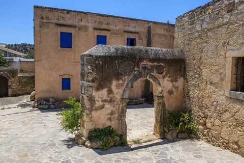 View of old historical Tor tor behind building with blue shutters of Ethnological Museum, Vori,