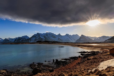 Cloudy mood at the sea in front of Bergen, sunbeams, Moskenesoya, Lofoten, Norway, Europe
