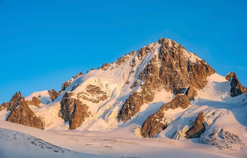 High alpine mountain landscape at sunset, summit of the Aiguille de Chardonnet and Glacier du Tour