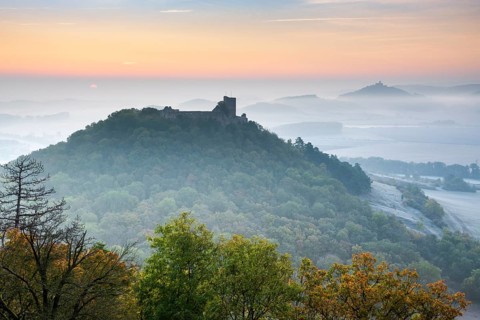 View of the ruins of Gleichen Castle at sunrise in autumn, Wachsenburg Castle in the background,