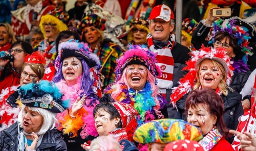 Colourfully costumed carnivalists celebrate carnival in Cologne, on Weiberfastnacht the street