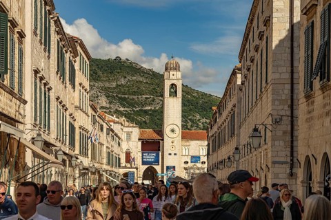 Main promenade Stradun or Placa and the landmark bell tower in Dubrovnik, Croatia, Europe