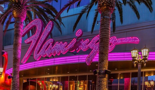 Purple and pink neon lights of the Flamingo Las Vegas Hotel and Casino on the Las Vegas Strip in
