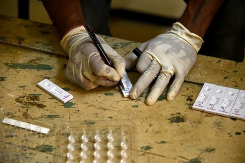 A health worker working before Covid-19 Rapid Antigen Testing (RAT), at a Swab collection centre