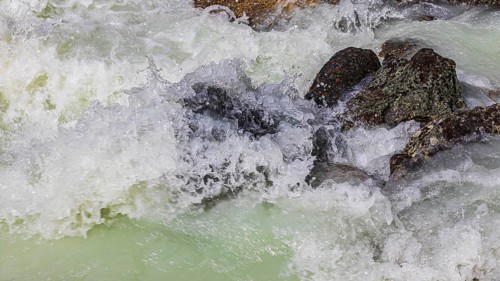 Dark boulders in a glacial stream, near Grimentz, Val d'Anniviers, Valais Alps, Canton Valais,