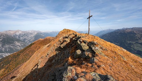Summit cross on the ridge of the Venet, in autumn, Venet crossing, Ötztal Alps, Tyrol, Austria,