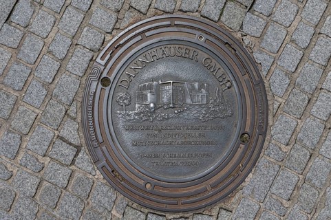 Manhole cover with self-advertising of the manhole cover manufacturer, Bad Kissingen, Lower
