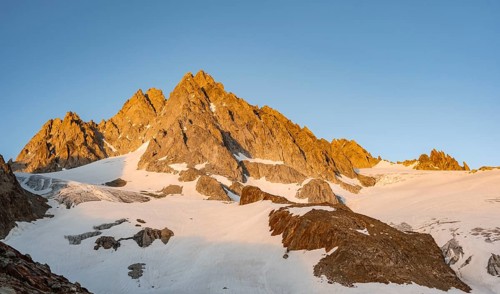 Rocky mountain peak, summit of the Aiguille de Tour in the evening light at sunset, Chamonix,