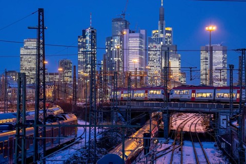 Railway tracks in front of the main railway station in Frankfurt am Main, skyline of skyscrapers in