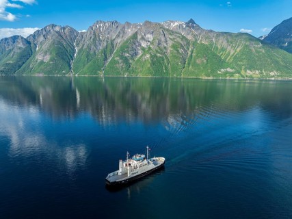 Ferry Trandal-Standal arrives at Standal, aerial view, fjord Hjoerundfjord, Norway, Europe
