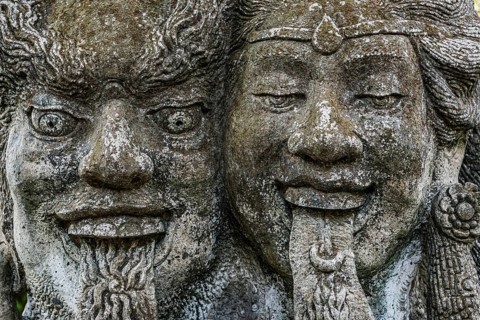 Temple figure, couple, woman, man, Hinduism, tongue, long, outstretched, facial expression, stone,