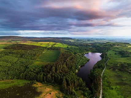 Sunset over Cod Beck Reservoir from a drone, North York Moors National Park, North Yorkshire,