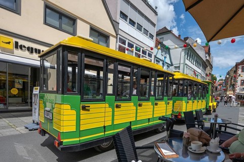 Tourist train runs through the town centre of Bad Kissingen, Lower Franconia, Bavaria, Germany,