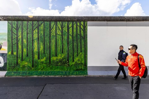 East Side Gallery. Remnant of the Berlin Wall, designed by artists. Landmark and city view Berlin,