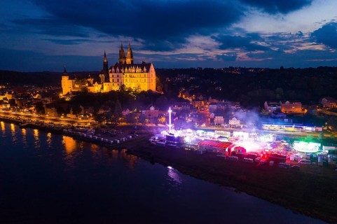 Albrechtsburg Castle and hustle and bustle on the Elbe for the wine festival, night shot from
