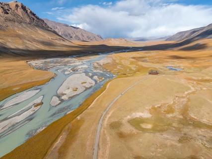 Aerial view, Burkhan mountain valley with meandering river, barren dramatic mountain landscape,