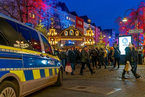 Police patrol car in front of the Christmas market on the Alter Markt in the old town of Cologne,