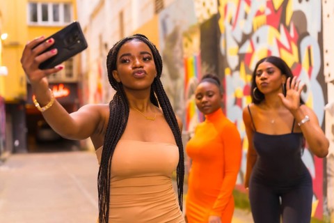 San Sebastián, Gipuzkoa Spain, February 2021: Three girls taking a selfie. Fashionable urban style