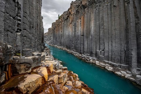 Stuðlagil Canyon, turquoise river between basalt columns, Egilsstadir, Iceland, Europe