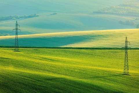 Moravian summer rolling landcsape with two power line tower. Moravia, Czech Republic, Europe