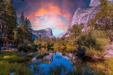 Reflections in the water of the Yosemite Mountains at Mirror Lake at sunset, Yosemite. California,