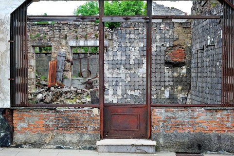 Burnt-out butcher's shop. The burnt village of Oradour-sur-Glane was destroyed on 10 June 1944 when