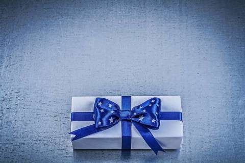 Packed box-container on metallic background celebrations concept