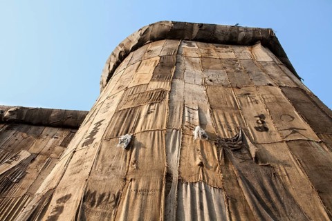 Torwache wrapped with old jute sacks, Check Point Sekondi Loco, by artist Ibrahim Mahama, documenta