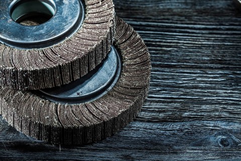 Used grinding discs on vintage wooden board