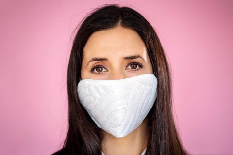 Young woman wearing a protective face mask during the Coronavirus disease COVID-19 outbreak