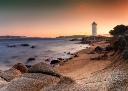 Long exposure view of the Punta Palau Lighthouse on the Emerald Coast of Sardinia at sunrise