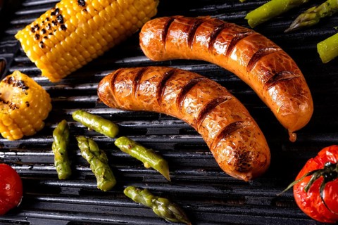 Grilled krakauer with french fries and green salad