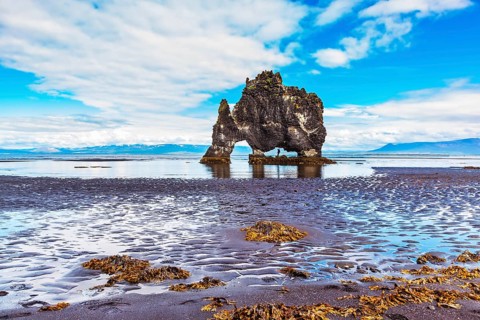 Stone mammoth Iceland. Hvitserkur picturesque rocks during low tide at sunset