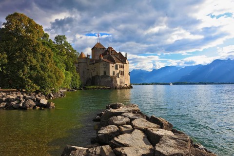 Lake in the mountains. Cold sunset Lake Geneva in the fall on sunny day. Montreux, Switzerland,