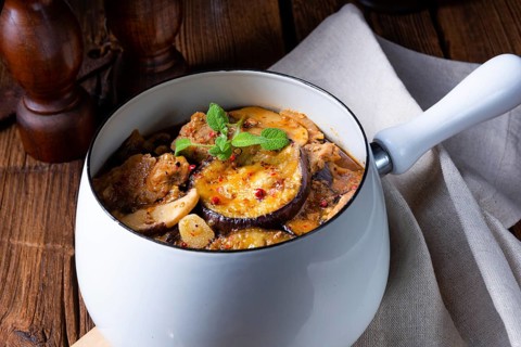 Veal goulash with baked aubergine and herbs